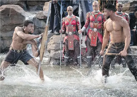  ??  ?? Chadwick Boseman, left, and Michael B. Jordan in a scene from Black Panther.