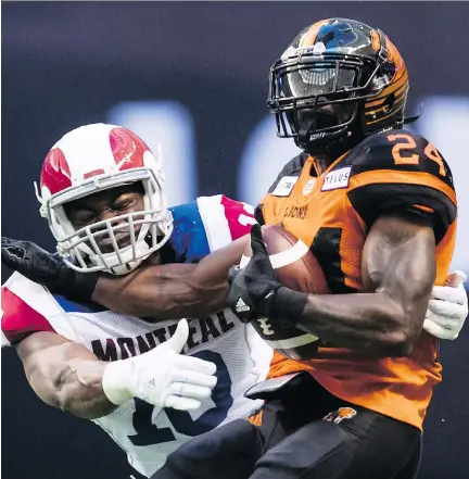  ?? DARRYL DYCK/THE CANADIAN PRESS ?? Montreal Alouettes lineback Henoc Muamba tackles B.C. Lions running back Jeremiah Johnson in the opening game of Muamba’s eighth season of playing profession­al football, a game for which he still has a passion and one at which he continues to excel.