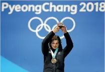  ??  ?? Nico Porteous, above, says it’s ‘‘super sick’’ that he and good friend Zoi Sadowski-Synnott, below, won their historic Winter Olympic medals on the same day.