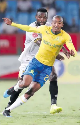  ?? Picture: BackpagePi­x ?? CLOSING IN. Thapelo Morena of Sundowns is challenged by Mwape Musonda of Leopards during their match last night.