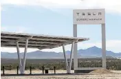  ?? LAUREN JUSTICE New York Times ?? A Tesla charger station for electric vehicles is shown on March 11 in Barstow, California. Tesla has said it will no longer take the lead in expanding the number of places to fuel electric vehicles.