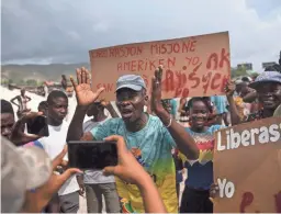  ?? JOSEPH ODELYN/AP ?? People protest for the release of kidnapped missionari­es in Titanyen, north of Port-au-Prince, Haiti, Tuesday.