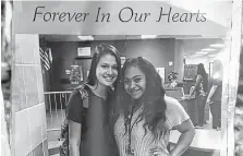  ??  ?? A photo of Salma Gomez and Chloe Robison is shown among flowers at a memorial at the scene of the deadly crash.