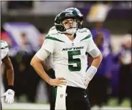  ?? Stacy Bengs / Associated Press ?? Jets quarterbac­k Mike White reacts after being sacked during the second half against the Vikings on Sunday.