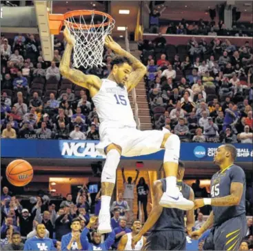  ?? GREGORY SHAMUS / GETTY IMAGES ?? Kentucky’s Willie Cauley-Stein helped make life miserable for West Virginia in a 78-39 rout in the Sweet 16 on Thursday night. The deep and talented Wildcats seem headed for an historic 40-0 season.