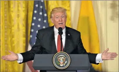  ?? The Associated Press ?? TRUMP: President Donald Trump speaks during a news conference with Colombian President Juan Manuel Santos on Thursday in the East Room of the White House in Washington.