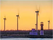  ??  ?? Barry Burgess's photos are always golden. What a dramatic background for the lovely Pubnico lighthouse and wind farm. Did you know there are now more than 300 commercial wind turbines generating electricit­y in Nova Scotia?