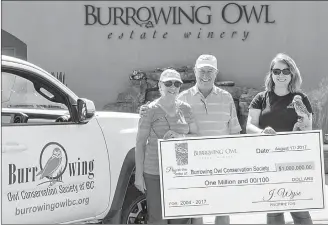  ?? Special to The Herald ?? Burrowing Owl Estate Winery has raised more than $1 million for nature conservati­on. Marking the milestone are Midge and Jim Wyse along with Lauren Meads (with Pluto).