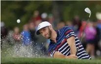  ?? Associated Press ?? United States' Dustin Johnson hits from a bunker on the 12th hole during a practice round for the Ryder Cup golf tournament Thursday at Hazeltine National Golf Club in Chaska, Minn.