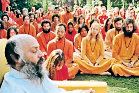  ??  ?? Power: cult leader Bhagwan Shree Rajneesh with devotees, and right, his secretary Ma Anand Sheela, a ‘woman drunk on power’