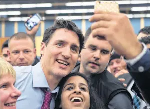  ?? THE CANADIAN PRESS/ANDREW VAUGHAN ?? Prime Minister Justin Trudeau works his way through the crowd at a town hall meeting in Lower Sackville, N.S. on Tuesday.