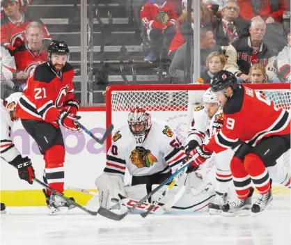  ??  ?? NEWARK: Corey Crawford #50 of the Chicago Blackhawks defends the net against the New Jersey Devils during the third period at the Prudential Center on October 28, 2016 in Newark, New Jersey. The Blackhawks defeated the Devils 3-2 in overtime.—AFP