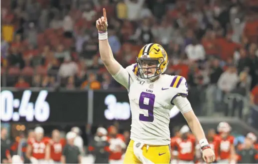  ?? JASON GETZ/USA TODAY SPORTS ?? LSU quarterbac­k Joe Burrow celebrates a touchdown in the SEC title game.