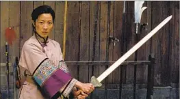  ?? ?? JEN (Zhang) takes on Li Mu Bai (Chow Yun-fat), and Shu Lien (Yeoh) is ready.