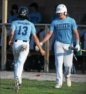  ?? RANDY MEYERS — THE MORNING JOURNAL ?? South’s Emerson Mancisio is congratula­ted by John Susnik after scoring against Keystone.