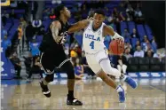  ?? DANNY MOLOSHOK ?? UCLA guard Jaylen Hands, right, drives around Long Beach State guard Deishuan Booker, left, during the first half of an NCAA college basketball game Friday, Nov. 9, in Los Angeles.