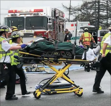  ?? NICHOLAS BUONANNO — NBUONANNO@TROYRECORD.COM ?? A student actor from Tamarac High School gets pulled away on a stretcher during a mock DWI casualty drill at the high school Friday morning.