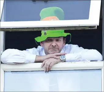  ?? Photo by John Tarrant ?? Nigel Scouler gets a perfect view from the Wallis Arms Hotel at the St Patrick’s Day Parade in Millstreet.