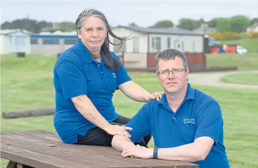  ?? Photograph by Sandy McCook ?? HOSPITALIT­Y: Lynn and Darren Redfern, who are the owners of the Dornoch Caravan and Camping Park.