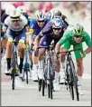  ??  ?? Britain’s Mark Cavendish, wearing the best sprinter’s green jersey, sprints to win the tenth stage of the Tour de France cycling race over 190.7 kms with start in Albertvill­e and finish in Valence, France. (AP)