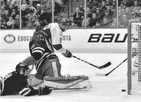  ?? John Autey, St. Paul Pioneer Press file ?? Bobby Brink scores during the 2018 Minnesota high school state tournament. He had 68 points in 43 games last season in the United States Hockey League, the top junior league sanctioned by USA Hockey.