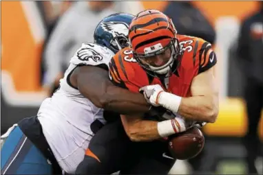  ?? THE ASSOCIATED PRESS — GARY LANDERS ?? Eagles defensive tackle Bennie Logan, here jarring the ball loose from Bengals running back Rex Burkhead Dec. 4, is the biggest name of nine free agents that the cash-strapped Eagles will struggle to re-sign for next year.