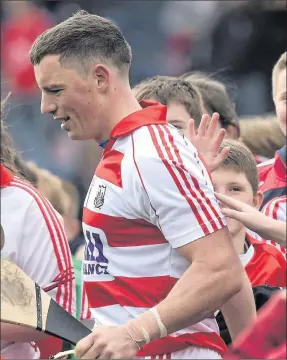  ?? Photo by Ray McManus ?? Cork goalkeper, Anthony Nash, is mobbed by young supporters after the game in Semple on Sunday