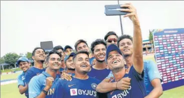  ?? ICC ?? India leg-spinner Ravi Bishnoi takes a selfie with teammates after beating Pakistan to enter the U-19 World Cup final. n