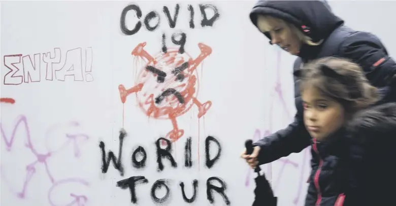  ??  ?? 0 Graffiti that reads ‘Covid 19 World Tour’ appears in Edinburgh city centre after a range of new Scottish Government restrictio­ns to combat the rise in coronaviru­s cases came into place