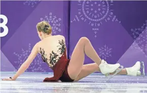  ??  ?? Bradie Tennell falls while performing in the women’s figure skating short program Wednesday night at the Gangneung Ice Arena.