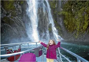  ??  ?? The Sterling Falls showers Zofia with water at Milford Sound on the Real Journeys Milford Sound cruise.