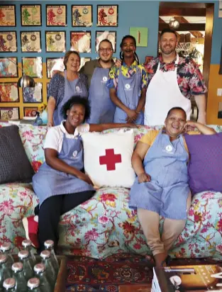  ??  ?? LEFT Stasie Street Kitchen’s team of stalwarts: standing, from left, Marita “Papiere” Pieterse, Frikkie Janse van Rensburg, Danny Opperman and Mynhardt; and sitting, Jasmine “Sponsie” Fransman, and Corleen “Vytjie” McGee, Danny’s wife and master baker of fruit cakes.