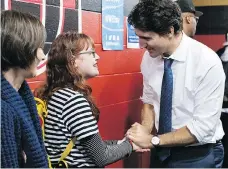  ??  ?? “I am never going to say anything positive about CF,” said activist Annie Bartlett, seen with Prime Minister Justin Trudeau. “But now I know that I can create goodness from something truly devastatin­g.”