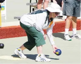  ?? ?? Above: Warragul second Gladys Atkinson bowls against Morwell in division one on Tuesday.