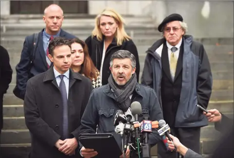  ?? Cloe Poisson / Associated Press ?? Ian Hockley, father of Dylan Hockley, one of the children killed in the 2012 Sandy Hook shooting, addresses the media after a hearing before the state Supreme Court in Hartford, Tuesday, Nov. 14, 2017.