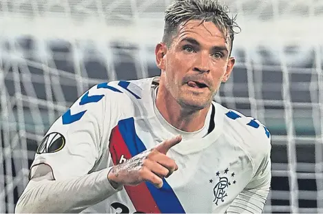  ??  ?? Kyle Lafferty wheels away after grabbing Rangers’ second equaliser – his first goal in European football.