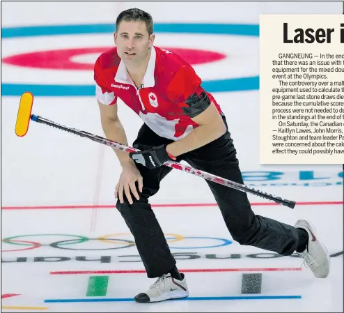  ?? MICHAEL BURNS ?? Canada’s John Morris tries to keep his balance after delivering a stone during a 7-3 victory over South Korea in mixed doubles curling at Gangneung. Canada clinched first place in the round robin with the win.