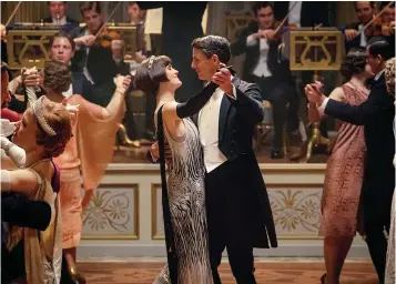 ?? Focus Features ?? ■ Michelle Dockery as Lady Mary Talbot, center left, and Matthew Goode as Henry Talbot are shown in a scene from "Downton Abbey."