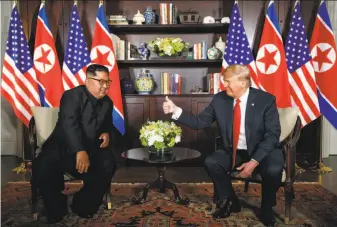  ?? Evan Vucci / Associated Press ?? The document President Trump signed with North Korean leader Kim Jong Un seems to amount mostly to a restatemen­t of long-assumed principles and an agreement to keep talking.