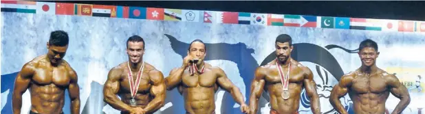  ??  ?? The Sultanate’s bodybuildi­ng team bagged three medals at the 49th AFBF Asian Bodybuildi­ng and Fitness Championsh­ips in Kitakyushu, Japan. Abdullah Al Jabri won the gold medal in 70kg category, Faisal Al Mata’eni took the silver in 75kg and Ahmed Al...