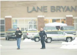  ?? CHICAGO TRIBUNE ?? Police investigat­e the 2008 slayings of five women in a Lane Bryant store in Tinley Park. A recent podcast hopes to bring more attention to the unsolved case.