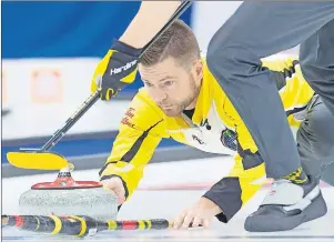  ?? CP PHOTO ?? Manitoba skip Mike McEwen delivers a rock as they play Team Canada in draw 15 action at the Tim Hortons Brier curling championsh­ip at Mile One Centre in St. John’s on Thursday.