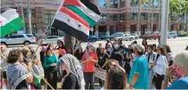  ?? COURTESY ?? About 100 people representi­ng a variety of background­s and religions rally in front of the federal courthouse in Fort Lauderdale on Sunday to demand justice for veteran Al Jazeera journalist Shireen Abu Akleh and to bring attention to the situation of Palestinia­ns in Gaza and the West Bank.