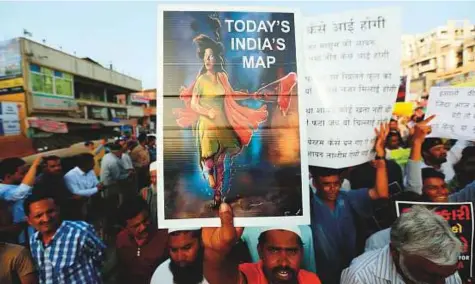  ?? AP ?? People march during a protest against recent incidents of rape, in Ahmadabad. Fresh rounds of protests have erupted recently, ■ triggered by the rape and murder of an 8-year-old girl in Kashmir and the abduction and rape of a teenage girl in Uttar...