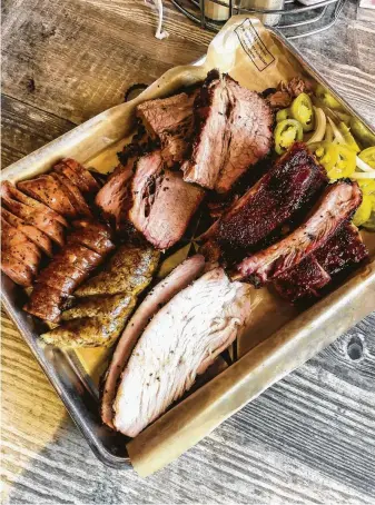  ?? J.C. Reid / Contributo­r ?? When cooked well, barbecue-joint turkey stands up to even the best brisket.