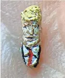  ??  ?? Donald Trump painted on a grain of rice. See more at jsonline.com/news.