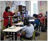  ??  ?? LEFT: Theresa Replogle teaches an English language arts class at Centervill­e High School.