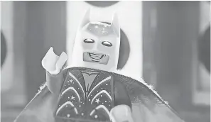  ??  ?? Lego Batman (voiced by Will Arnett) gets some great new clothes in “The Lego Movie 2: The Second Part,” including a wedding suit. WARNER BROS.