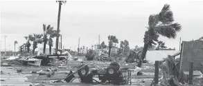  ?? GABE HERNANDEZ / CORPUS CHRISTI CALLER-TIMES VIA AP ?? Scenes of devastatio­n after Hurricane Harvey landed Saturday in Texas. Harvey came ashore Friday as a Category 4 storm with 130 mph (210 km/h) winds.