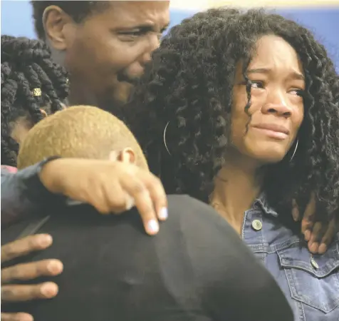  ?? — SCOTT OLSON/GETTY IMAGES ?? Family members of Ruth Whitfield listen as an attorney speaks Monday in Buffalo, N.Y. Whitfield, 86, was killed when a gunman opened fire at a store Saturday, killing 10 people and wounding another three.